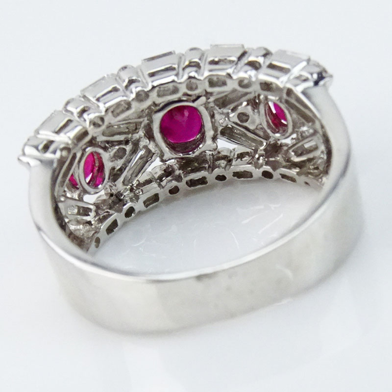 . 2.50 Carat Round Brilliant and Baguette Cut Diamond, Oval Cut Ruby and 18 Karat White Gold Ring. 