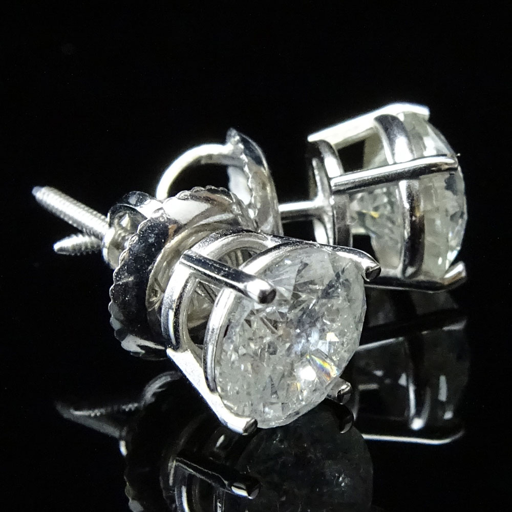 AIG Certified Pair of 2.01 Carat Round Brilliant Cut Diamond and 14 Karat White Gold Ear Studs.