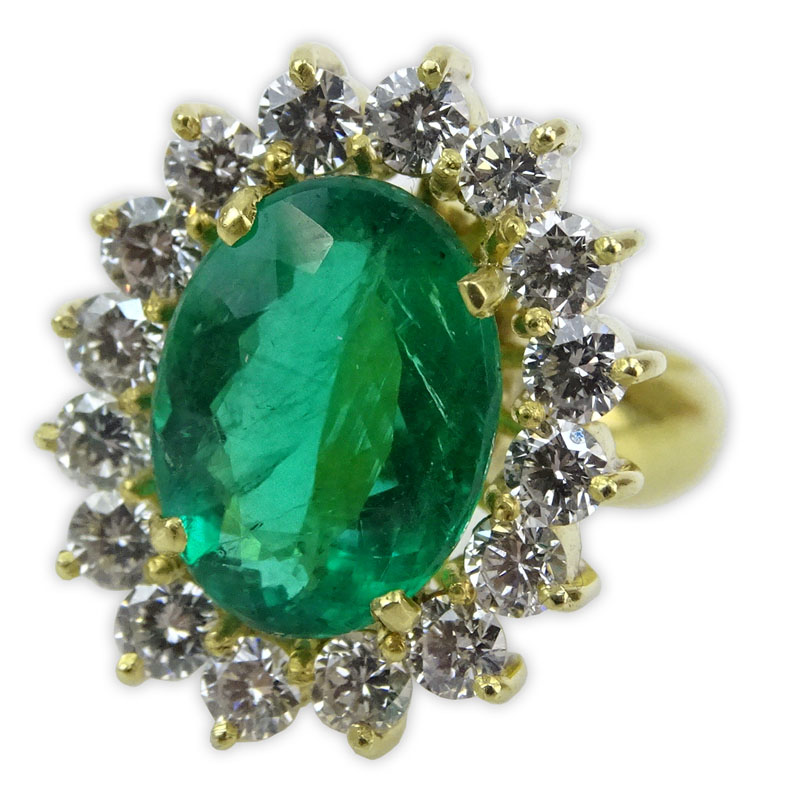 Oval Cut Brazilian Emerald, Approx. 4.15 Carat Round Brilliant Cut Diamond and 18 Karat Yellow Gold Ring. 
