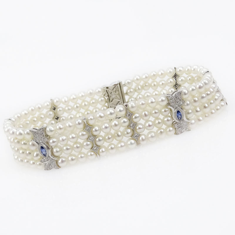 Four Strand Pearl, Approx. .40 Carat Diamond and 18 Karat White Gold Bracelet 