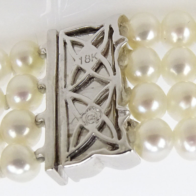 Four Strand Pearl, Approx. .40 Carat Diamond and 18 Karat White Gold Bracelet 