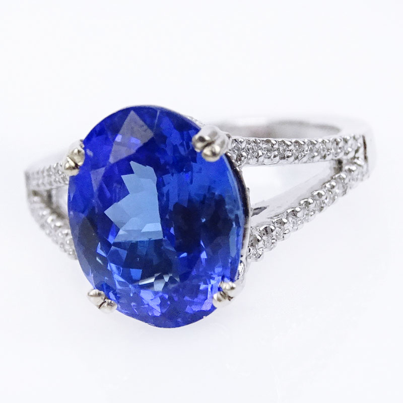 4.65 Carat Oval Cut Tanzanite and 14 Karat White Gold Ring accented with Small Round Cut Diamonds.