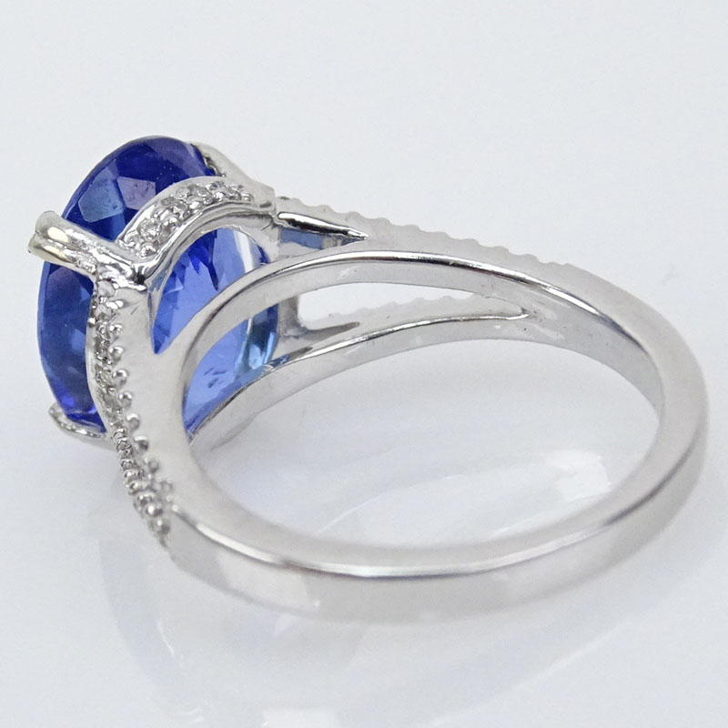 4.65 Carat Oval Cut Tanzanite and 14 Karat White Gold Ring accented with Small Round Cut Diamonds.
