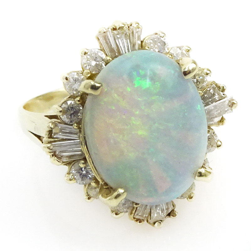 8.0 Carat Oval Cabochon Cut Opal, 1.50 Carat Baguette and Round Cut Diamond and 14 karat Yellow Gold Ring