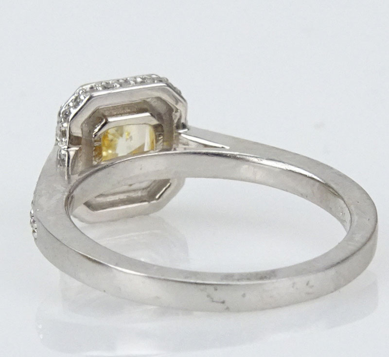 GIA Certified 1.20 Carat Cushion Cut Natural Fancy Light to Fancy Orangey Yellow Diamond and 18 Karat White Gold Engagement Ring.