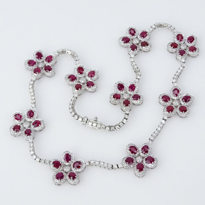 27.80 Carat Oval Cut Ruby, 12.18 Carat Round Brilliant Cut Diamond and 18 Karat White Gold Necklace and earring Suite.