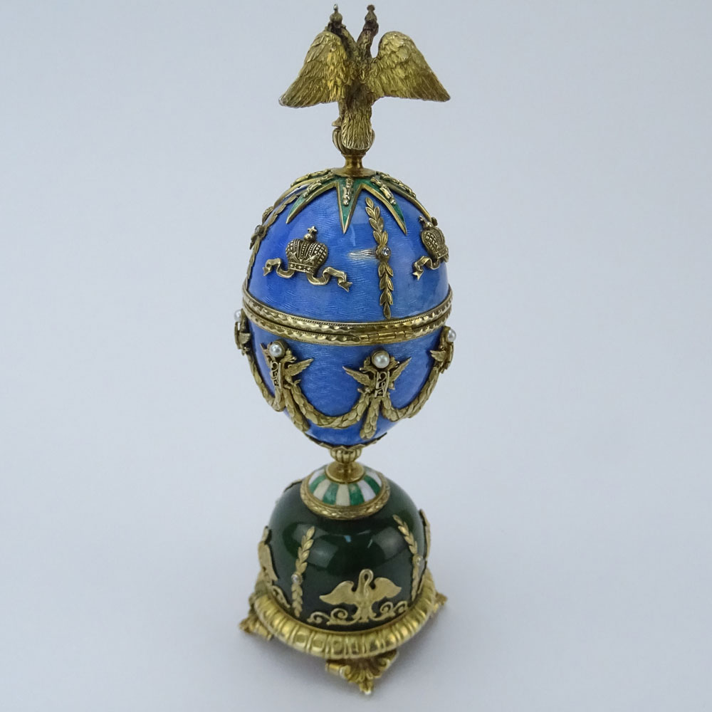 Early 20th Century Russian Gilt Silver, Nephrite Jade and Guilloche Enamel Egg accented with Rose Cut Diamonds and Seed Pearls and Topped with a Double Eagle Finial