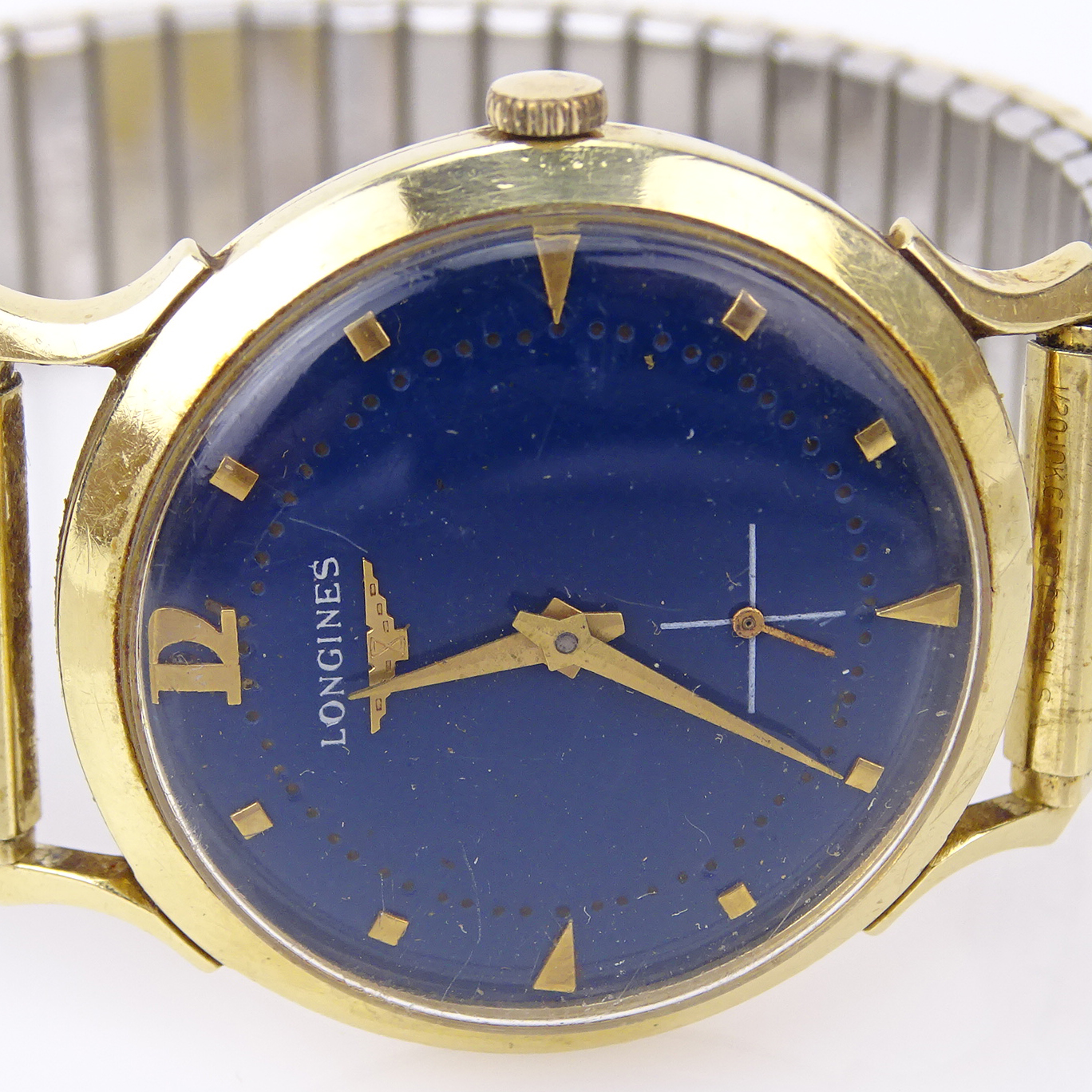 Man's Circa 1950s Longines Wittnauer 14 Karat Yellow Gold Watch with Blue Enamel Dial, Manual Movement and Twist on metal Bracelet
