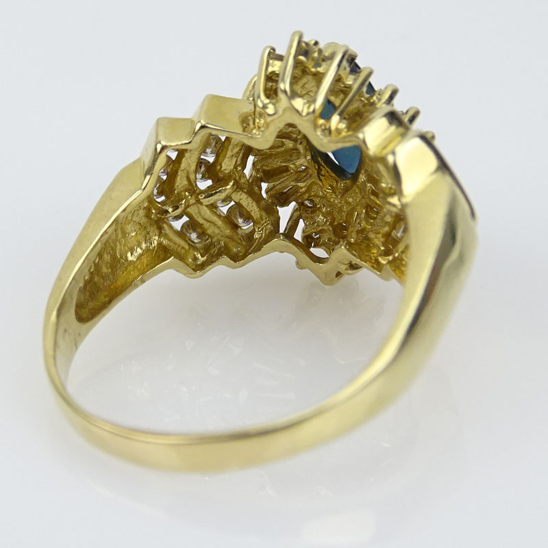 Lady's Marquise Cut Sapphire, Diamond and 14 Karat Yellow Gold Cluster Ring