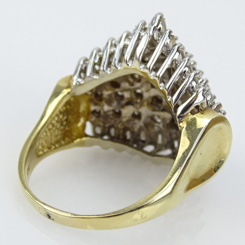 3.50 Carat Round Brilliant and Baguette Cut Diamond and 14 Karat Yellow and White Gold Ring.