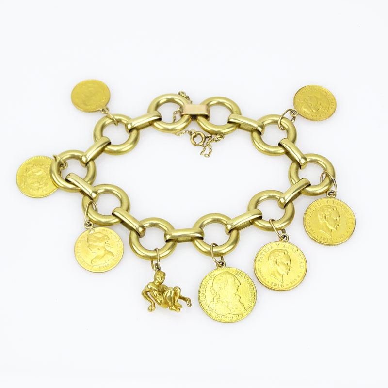 Vintage 18 Karat Yellow Gold Charm Bracelet with Seven Gold Coins Including Cuban, Mexican, Peruvian and Spanish Coins and a Reclining Man Charm