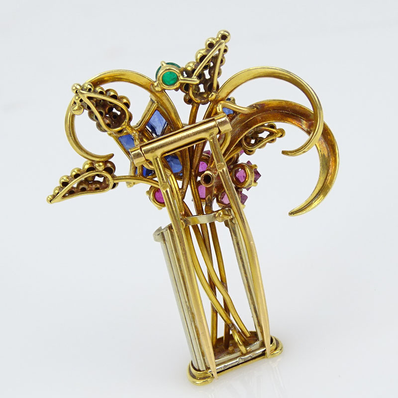 Circa 1940's 18 Karat Yellow Gold and Multi Gemstone Brooch set with Sapphires, Rubies, Emeralds and Diamonds
