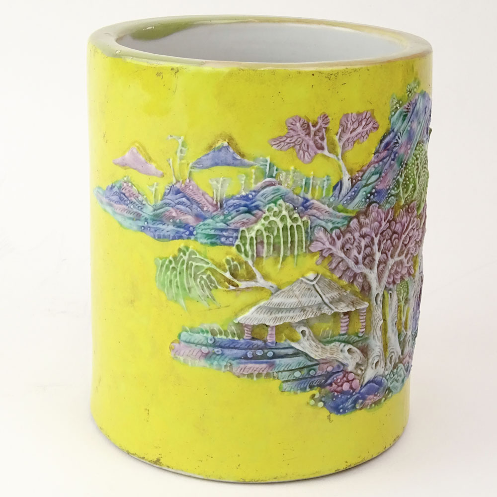 Chinese Guangxu (1875-1908) Famille Jaune Porcelain Brush Pot with Molded Relief Decoration Depicting a Mountain Village Landscape