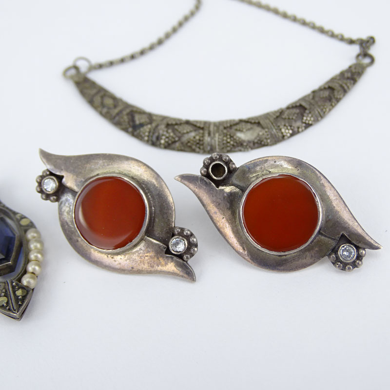 Miscellaneous Silver Lot Including Two (2) Marked 925 Necklaces, One (1) Marked 925 Bangle Bracelet, One (1) Sterling Marked Bird Brooch, One (1) 90% Marked Pendant, Unmarked Silver and Carnelian Earrings, Unmarked Silver, Seed Pearl, Marcasite Earrings