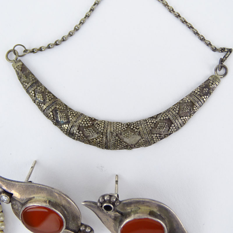 Miscellaneous Silver Lot Including Two (2) Marked 925 Necklaces, One (1) Marked 925 Bangle Bracelet, One (1) Sterling Marked Bird Brooch, One (1) 90% Marked Pendant, Unmarked Silver and Carnelian Earrings, Unmarked Silver, Seed Pearl, Marcasite Earrings