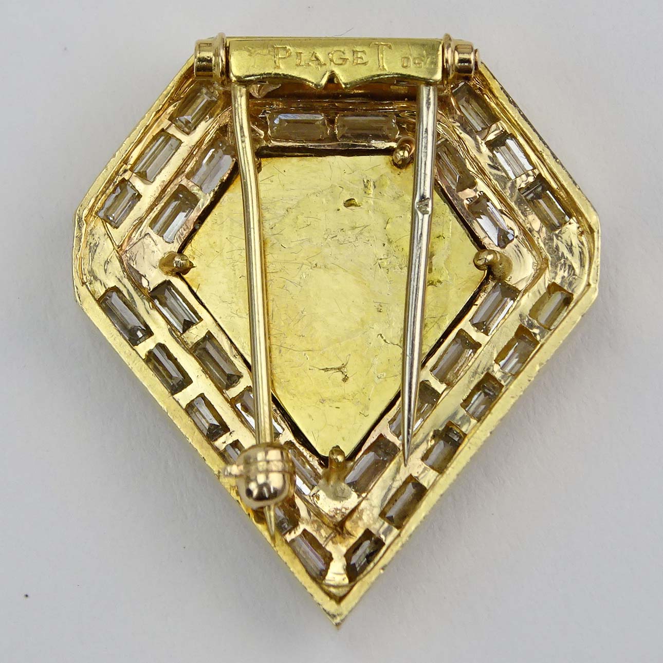 Vintage Piaget Approx. 3.25 Carat Baguette Cut Diamond, Black Onyx and 18 karat Yellow Gold Clip Brooch.