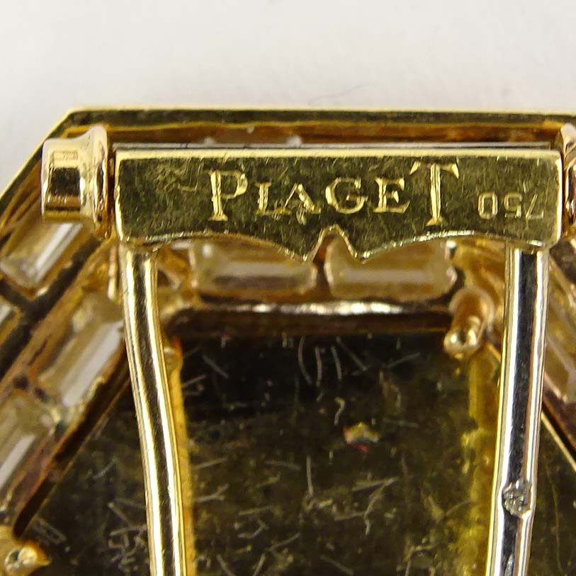Vintage Piaget Approx. 3.25 Carat Baguette Cut Diamond, Black Onyx and 18 karat Yellow Gold Clip Brooch.