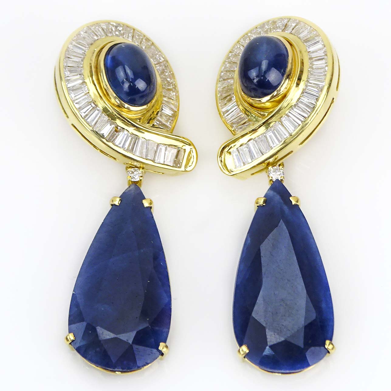 Vintage Large Pear Shape Sapphire, Cabochon Star Sapphire, Baguette Cut Diamond and 18 Karat Yellow Gold Detachable Pendant Earrings.