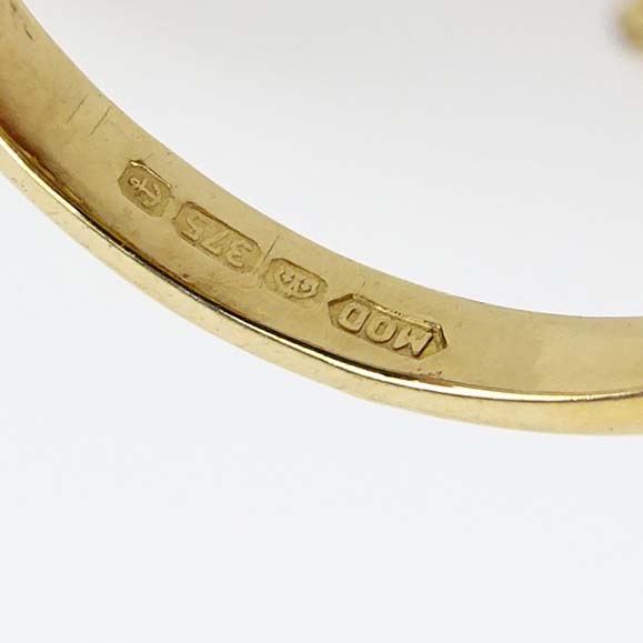 Contemporary 3.32 Carat Oval Cut Aquamarine, Diamond and 9 Karat Yellow Gold Ring. 