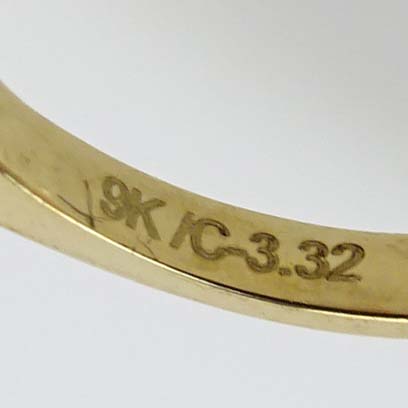 Contemporary 3.32 Carat Oval Cut Aquamarine, Diamond and 9 Karat Yellow Gold Ring. 