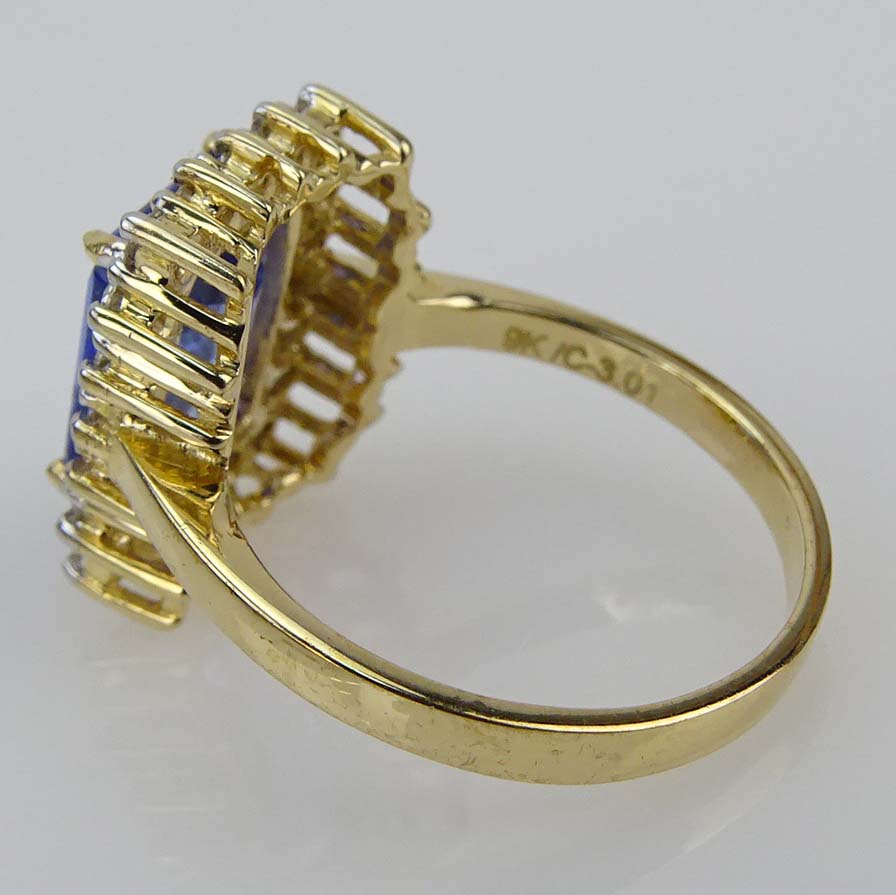 Contemporary 3.01 Carat Emerald Cut Tanzanite, Diamond and 9 Karat Yellow Gold Ring. 
