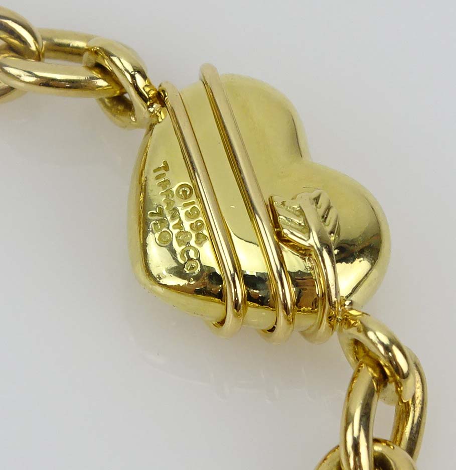 Tiffany & Co 18 Karat Yellow Gold Four Hearts Charm Bracelet.