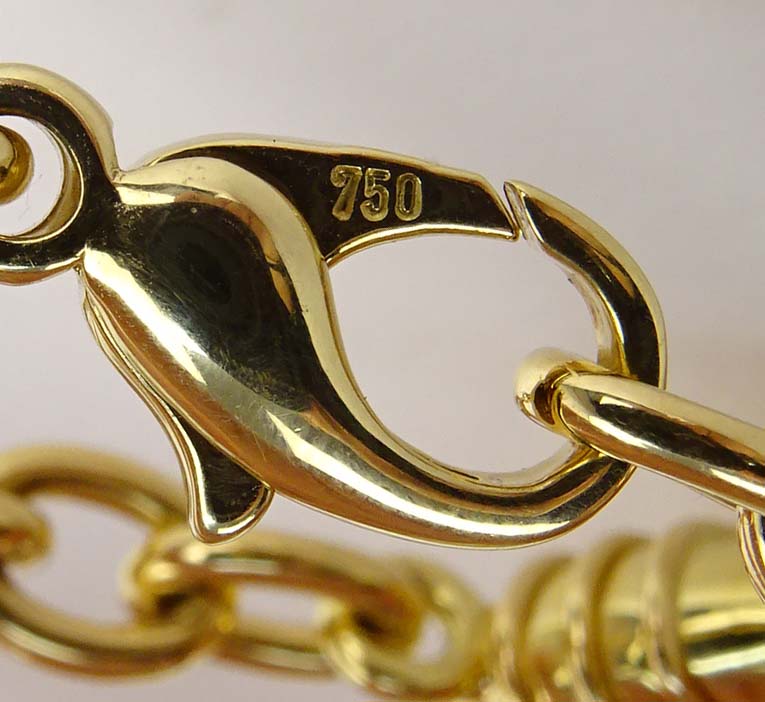 Tiffany & Co 18 Karat Yellow Gold Four Hearts Charm Bracelet.