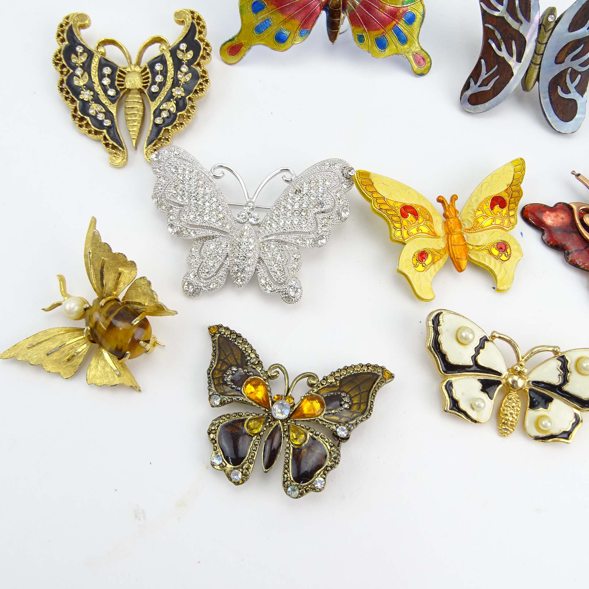 Collection of Fifteen (15) Fashion Butterfly Brooches decorated variously with enamel and faux gem stones.