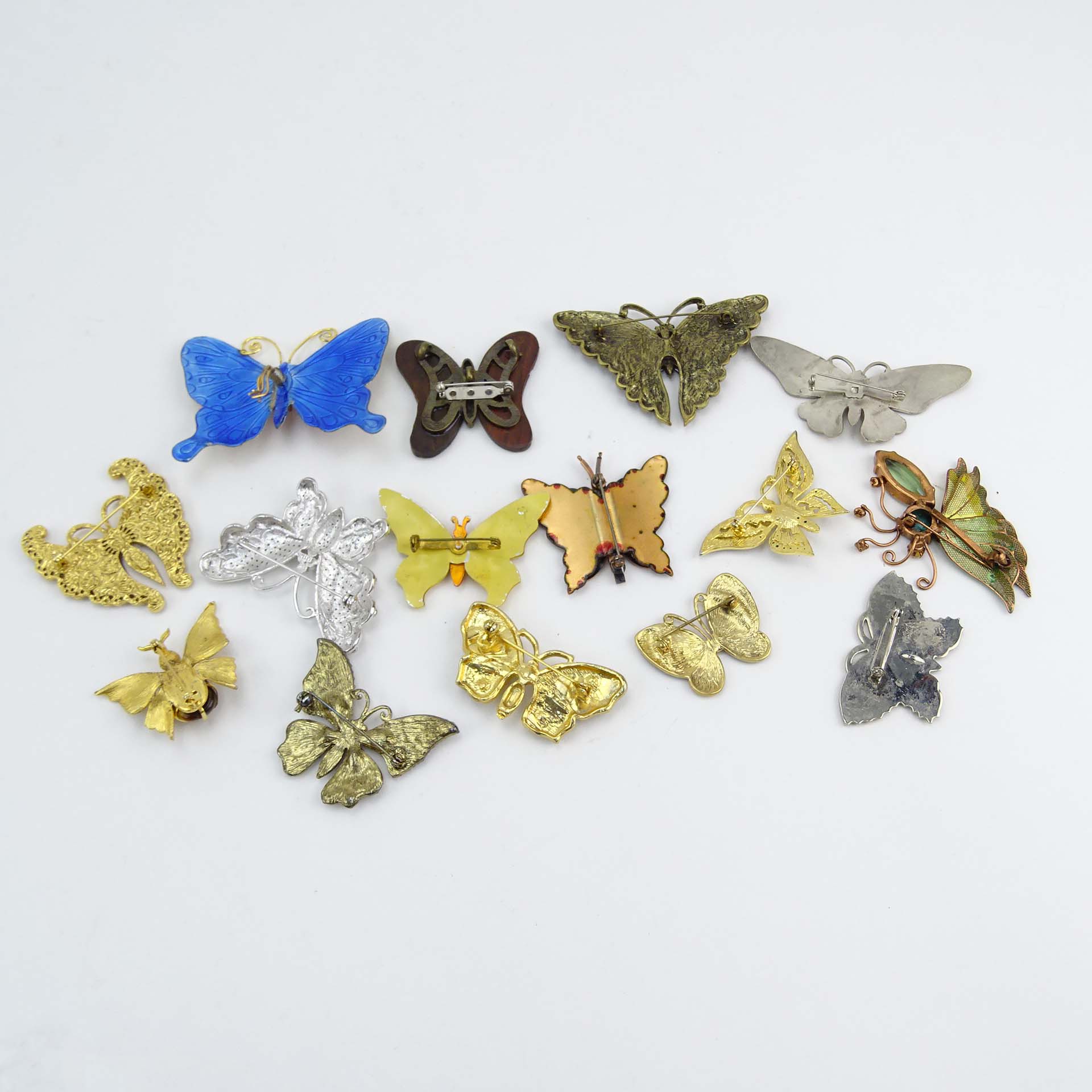 Collection of Fifteen (15) Fashion Butterfly Brooches decorated variously with enamel and faux gem stones.