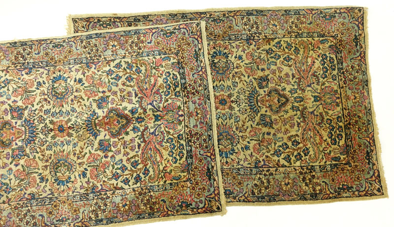 Pair of Semi Antique Kerman Rugs. Mainly tan with multi color floral motif.