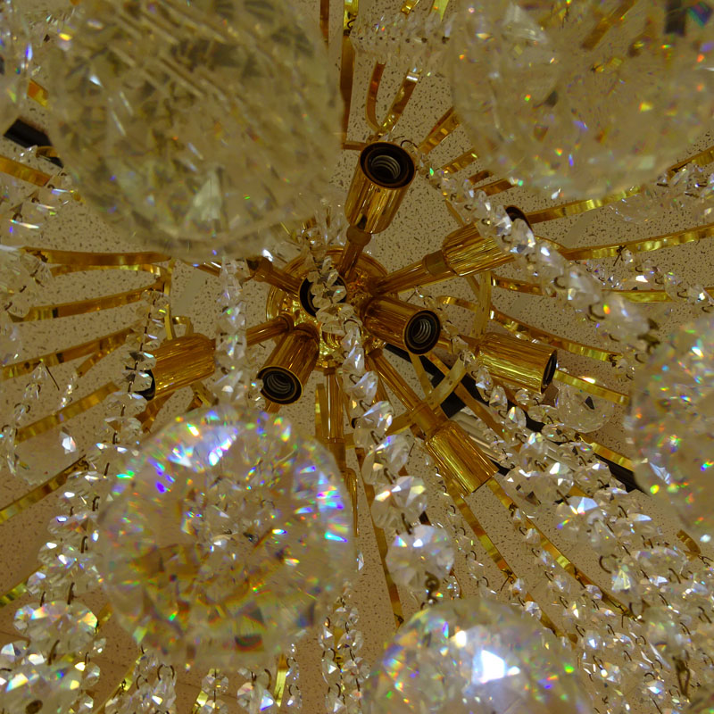 Fine Swarovski Crystal and Gilt 12 Light Chandelier.