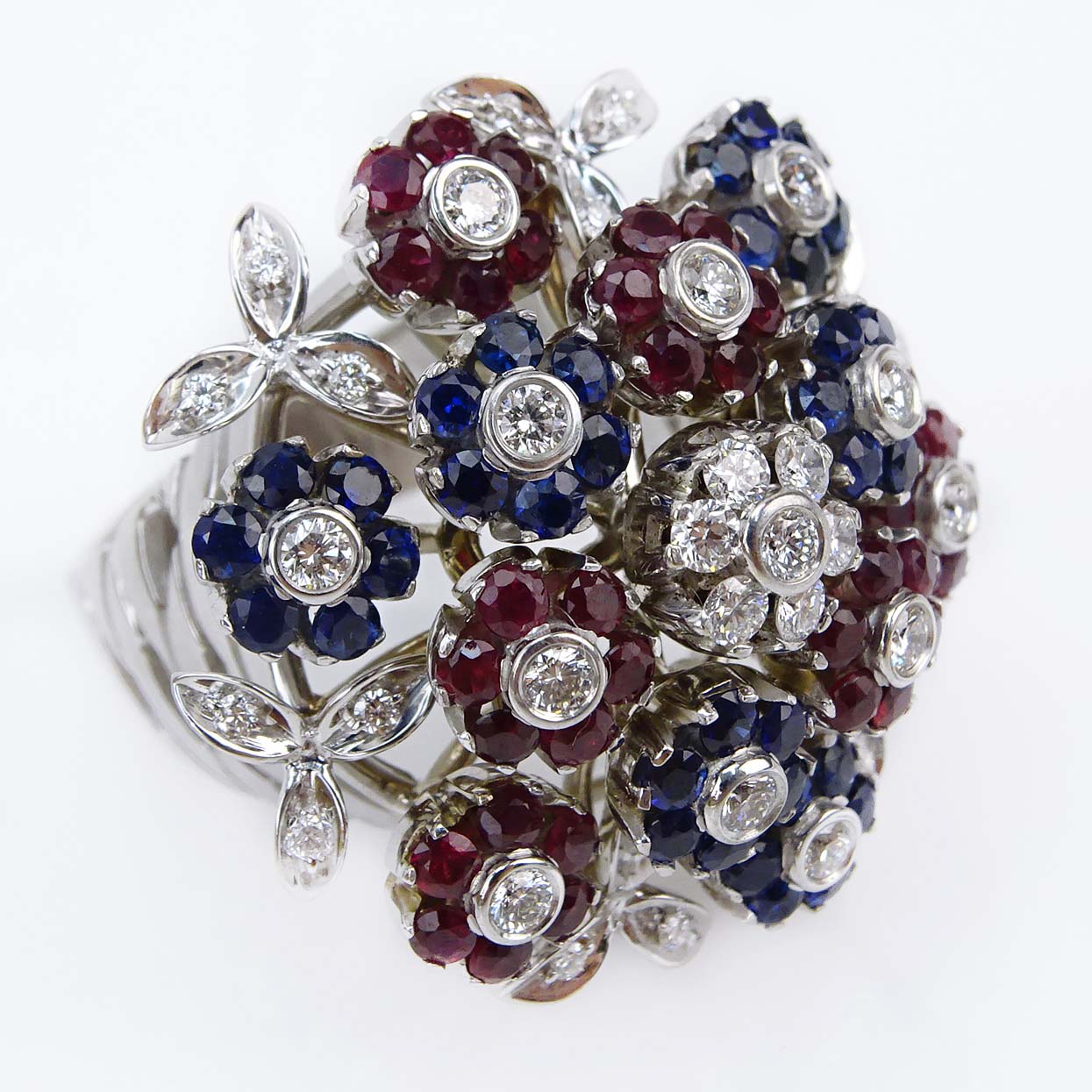 Vintage Cartier Diamond, Ruby, Sapphire and 18 Karat White Gold Ring en tremblant. 