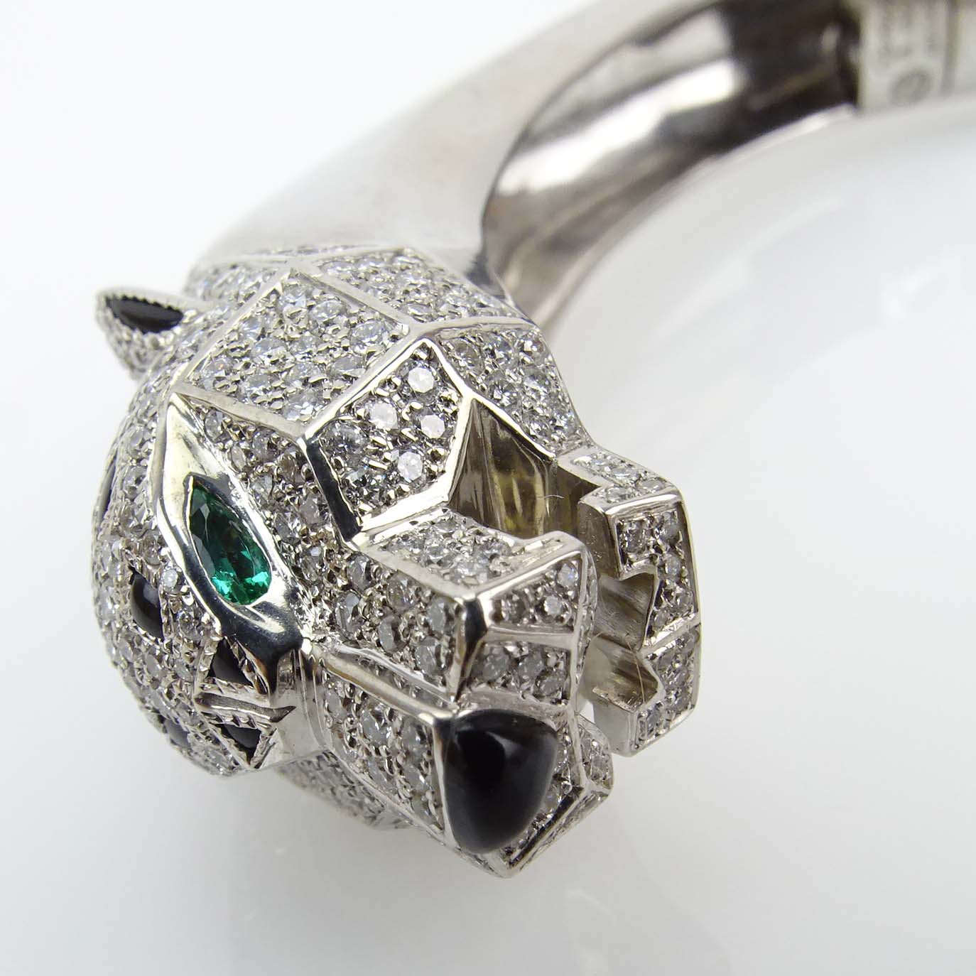 Cartier Approx. 4.0 Carat Pave Set Diamond, Black Onyx and 18 Karat White Gold Panther Bracelet with Emerald Eyes. 