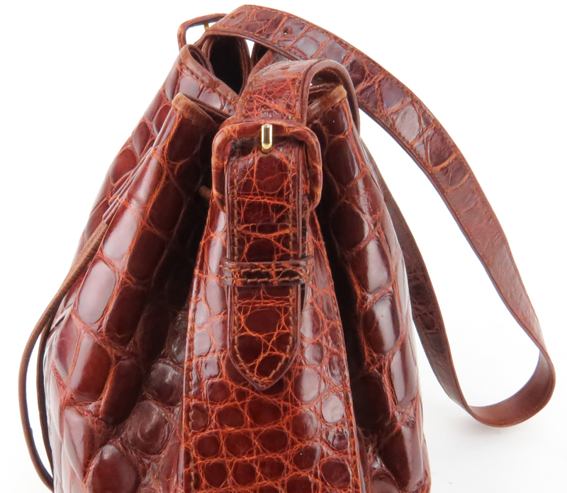 Lana Marks Russet Crocodile Drawstring Bucket Bag. Suede Interior with zipper pocket.