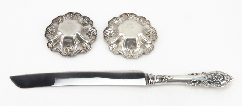 Grouping of Three (3) Sterling Silver Tableware. Includes a pair of Reed & Barton "Francis I" nut dishes along with a Sheffield sterling handle serving bread/cake knife. 