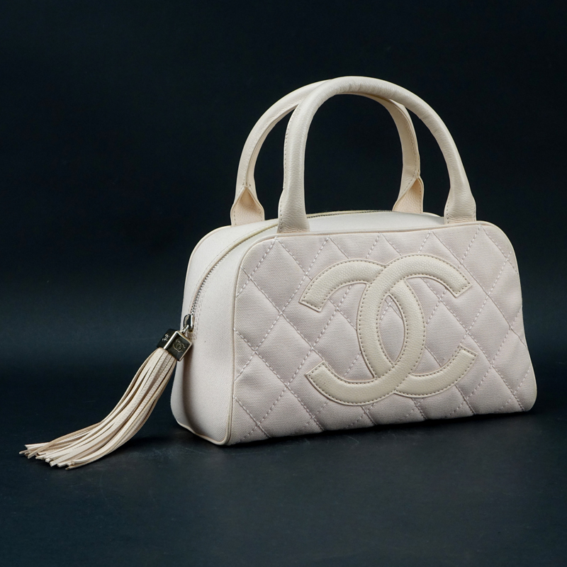 Chanel Baby Pink Quilted Canvas CC Logo Bowler Bag. Silver Tone Hardware, leather tassel zipper pull and handles. 