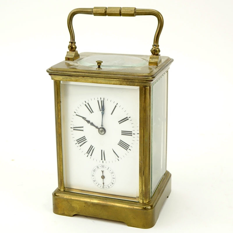 Late 19th Century French Aiguilles Gilt Brass Carriage Clock. Porcelain dial with double display, Roman and Arabic numerals. 