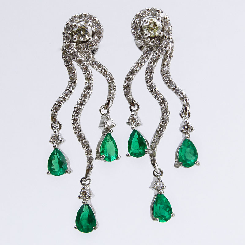 Approx. 1.80 Carat Pear Shape Emerald, 1.60 Carat Round Brilliant Cut Diamond and 18 Karat White Gold Earrings. 