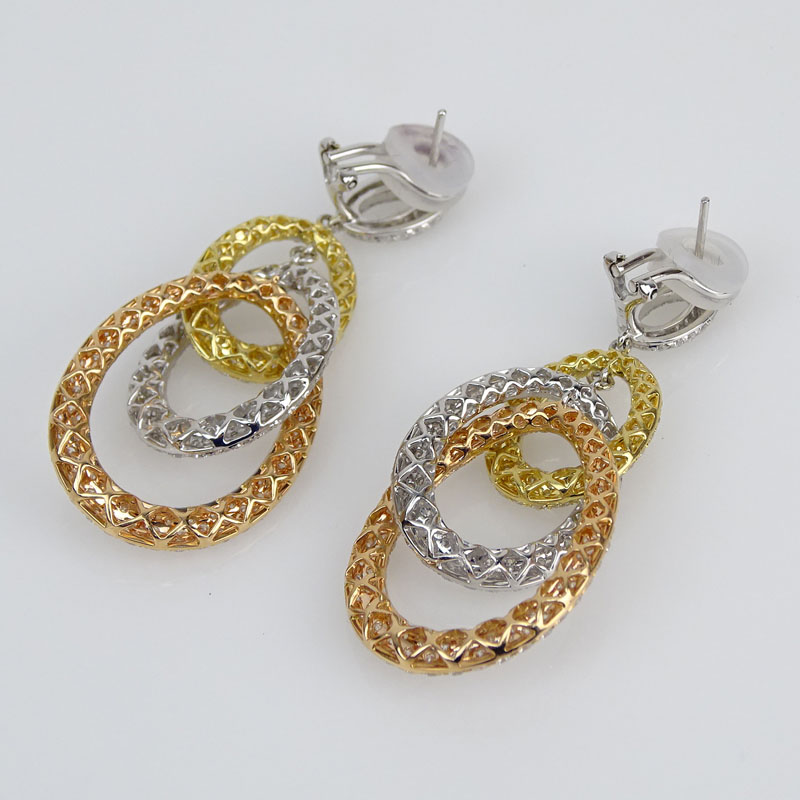 Cartier style Approx. 9.0 Carat Pave Set Round Brilliant Cut Diamond and Tricolor Gold Chandelier Earrings.