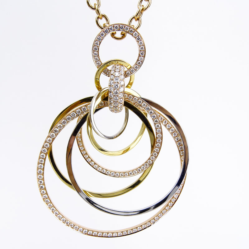 Cartier style Approx. 3.40 Carat Pave Set Round Brilliant Cut Diamond and 18 Karat Tricolor Gold Pendant Necklace.