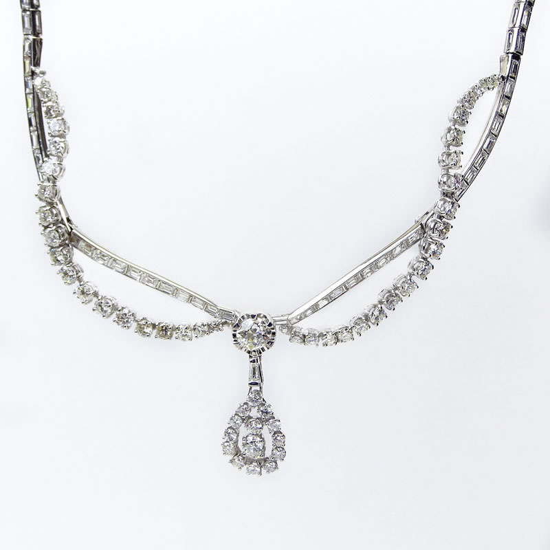 Approx. 16.0 Carat Round Brilliant and Baguette Cut Diamond and Platinum Pendant Necklace.