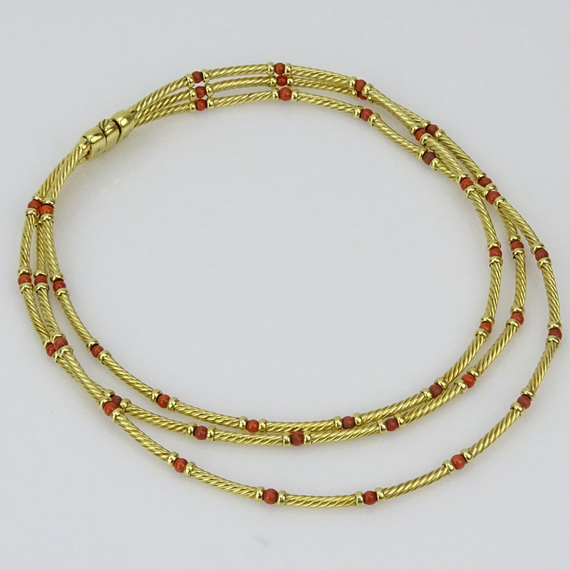 David Yurman 14 Karat Yellow Gold and Red Coral Bead Triple Cable Strand Necklace.