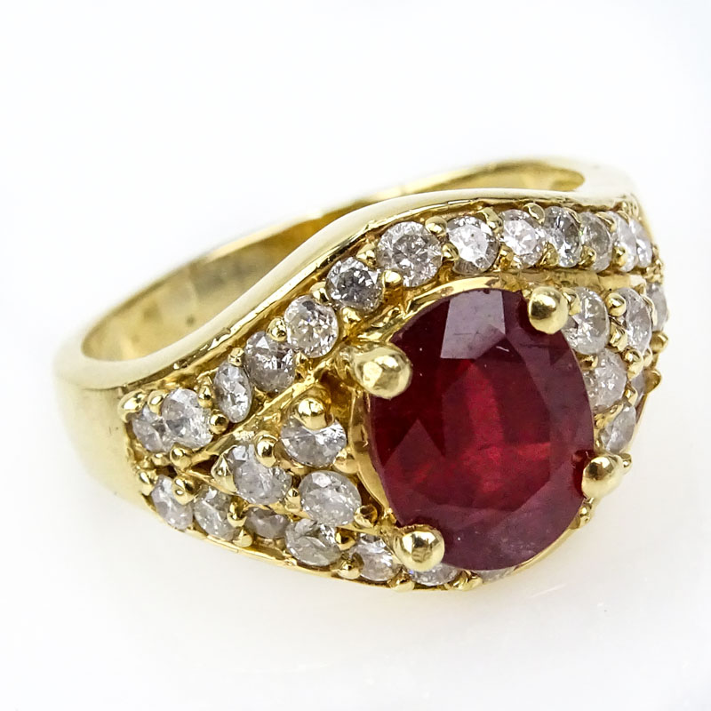 Vintage Oval Cut Ruby, Diamond and 14 Karat Yellow Gold Ring. 