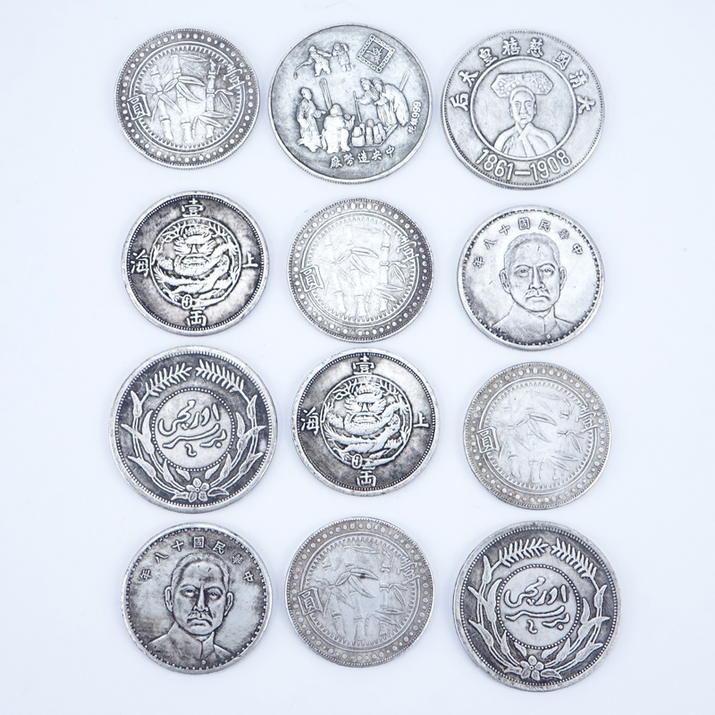 Collection of Twelve (12) Antique Chinese Silver-Metal Coins.