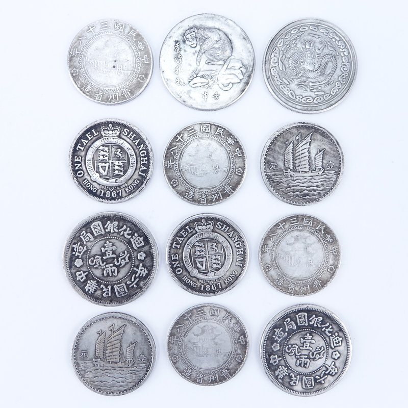 Collection of Twelve (12) Antique Chinese Silver-Metal Coins.