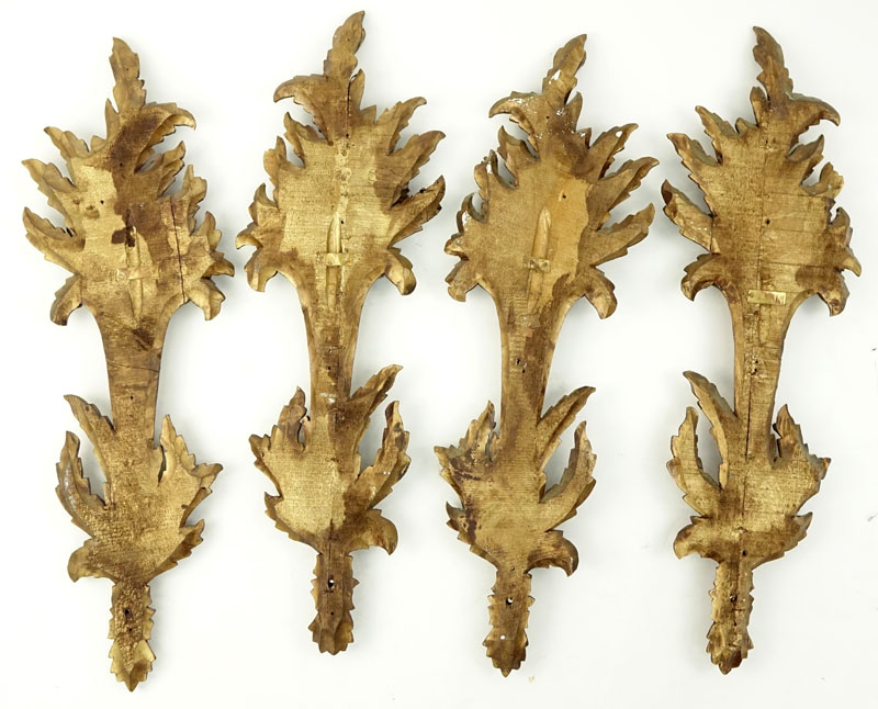 Set of Four (4) Carved Gilt Wood Wall Appliques.