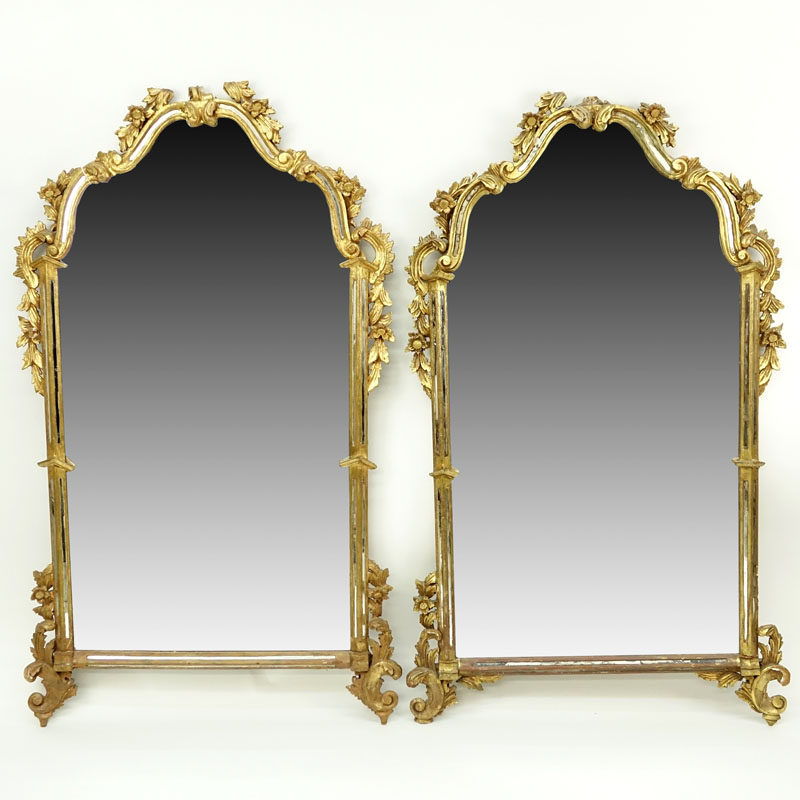 Pair of mid 20th Century Italian Carved and Giltwood Mirrors.