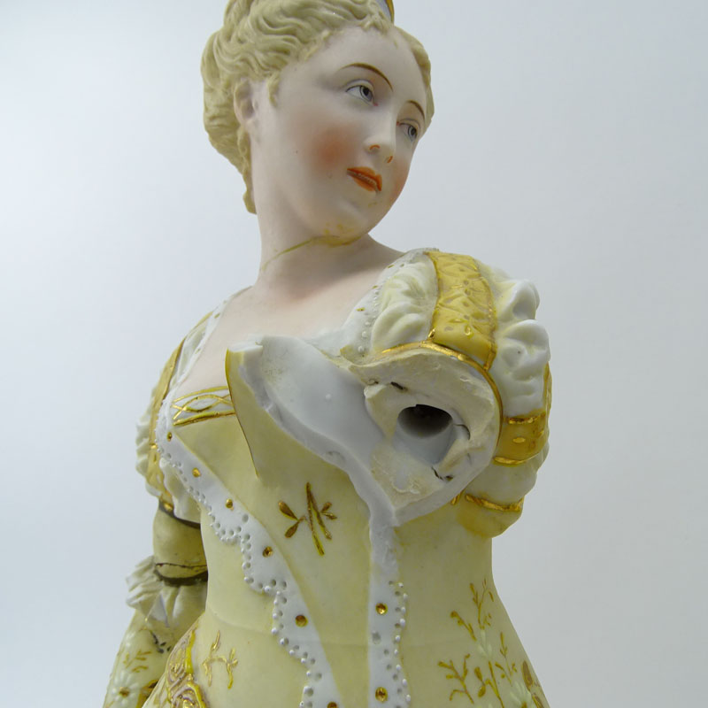 Two (2) Porcelain Figurines. Man & Woman in costume.