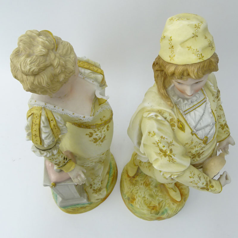 Two (2) Porcelain Figurines. Man & Woman in costume.