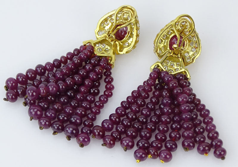 Very Fine Quality Bulgari style Burma Ruby, Diamond and 18 Karat Yellow Gold Tassel Earrings. Excellent quality stones throughout set with cabochon rubies, ruby beads, round brilliant and baguette cut diamonds. Signed 18. Very good condition. Measure 2-3/